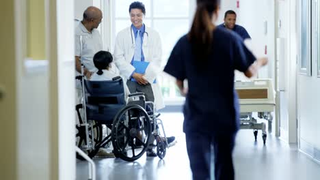 African-American-couple-female-in-wheelchair-in-hospital