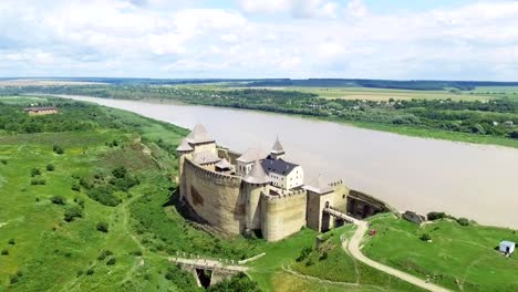 Aerial-Shot.-Old-castle-near-the-RIver.-Hotin-Castle-in-Ukraine.-Eastern-Europe