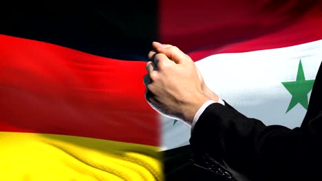 Germany-sanctions-Syria,-chained-arms,-political-or-economic-conflict,-trade-ban