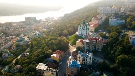 St.Andrew's-Church-and-Andriyivskyy-Descent-from-aeriel-above-view.-Kiev-Ukraine.-Morning-soft-sunrise-backlight