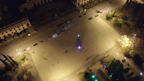 Aerial-view-of-the-night-view-of-the-Central-square-of-the-city-with-a-Christmas-tree.