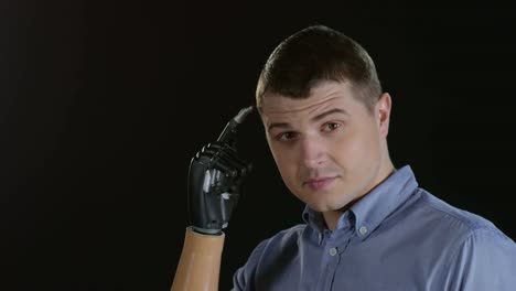 Man-Scratching-Temple-with-Prosthetic-Hand