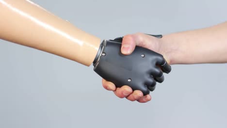 Person-with-Prosthetic-Arm-Shaking-Hands-with-Someone