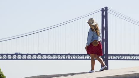 Young-girl-taking-selfie-at-background-famous-bridge