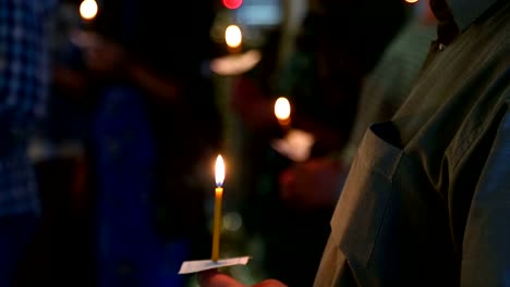 candles-in-the-hands-of-believers-in-the-Russian-Orthodox-Church