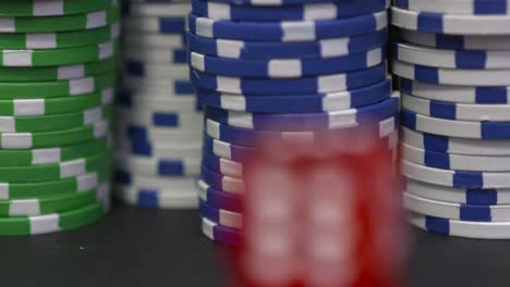 Two-red-dice-on-the-background-of-the-poker-game