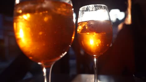 aperitif-at-sunset-in-terrace-with-on-background-woman