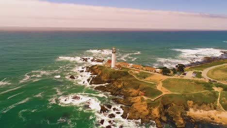 Light-House-Drone-Shot-Aerial-Helicopter-View-Ocean-Coast-Line-with-crashing-waves-sun-set-4K