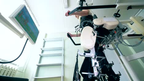 Physiotherapy-procedure-during-which-the-patient-is-training-to-walk.-Medical-robot.