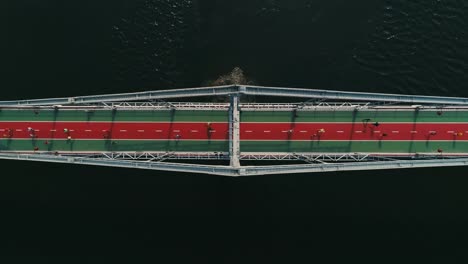 Marathon-running-on-the-footbridge.-Top-view-shot