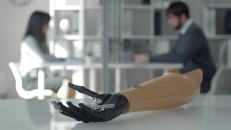 Bionic-Prosthetic-Hand-Moving-Fingers-on-Office-Desk