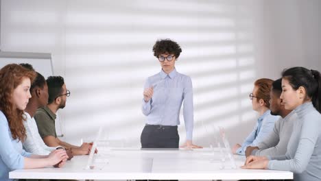 Female-Teacher-Giving-Lecture-and-Demonstrating-Touchscreen-Hand-Gestures