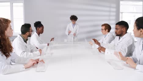 Female-Teacher-Demonstrating-Touchscreen-Hand-Gestures-for-Students