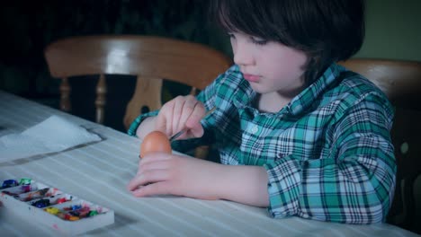 4K-Home-Shot-Of-Child-Painting-Easter-Eggs