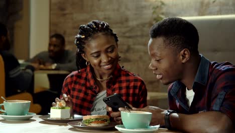 Attractive-young-black-couple-in-a-cafeteria