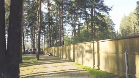 An-old-wooden-house-for-rest-around-forest-.-Video.-Background-of-trees,-nature