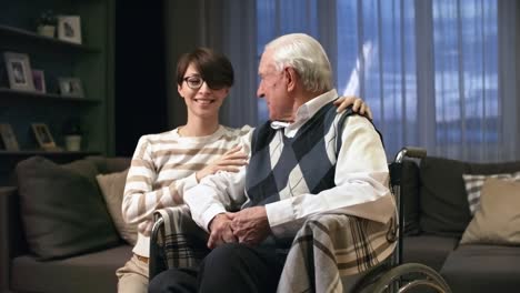 Granddaughter-Posing-with-Grandfather-in-Wheelchair