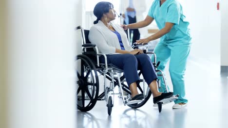 African-American-female-staff-and-disabled-patient-consult