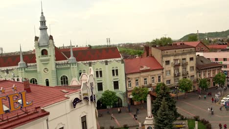 Aerial-view-Peace-Square-of-Mukachevo.-Nearby-is-the-Gothic-chapel-of-St.-Joseph,-city-hall-і-Cathedral-Church-of-St.-Martine.-Eastern-Carpathian-mountains.-Ukraine