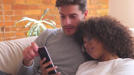 Couple-watching-online-content-on-smartphone