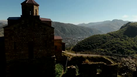 4K-UHD-Aerial-view-of-a-mountain-monastery-standing-on-a-cliff