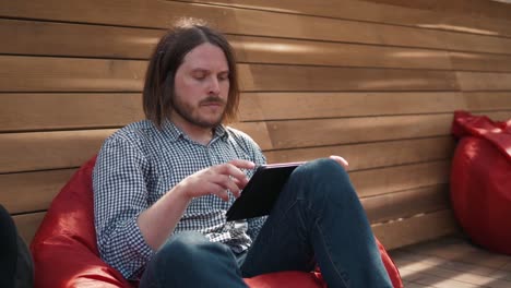 young-handsome-fashion-model-businessmen-using-tablet-outdoors,-man-male-portrait-with-tablet-in-city-work