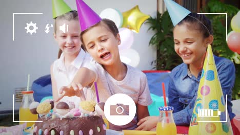 Taking-photos-of-children-at-birthday-party-on-a-digital-camera