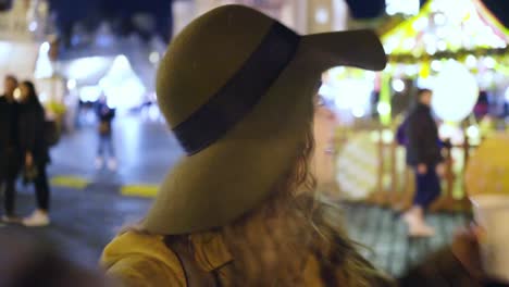 POV-girl-talking-on-camera-at-easter-market-in-Prague