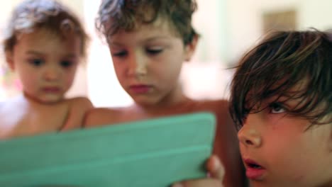 Children-using-tablet-device-at-home-candid-and-authentic