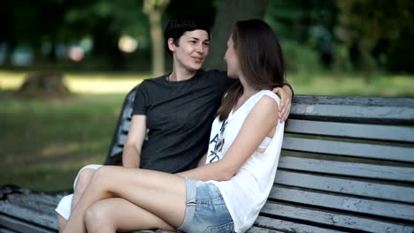 Lesbians-relaxing-on-the-bench-in-the-green-park