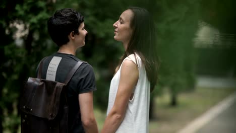 Two-lesbians-holding-hand-and-look-in-camera