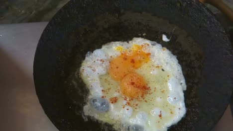 Half-fried-egg-in-pan