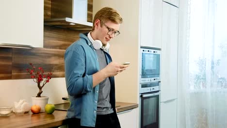 Young-man-using-phone-texting-using-social-network