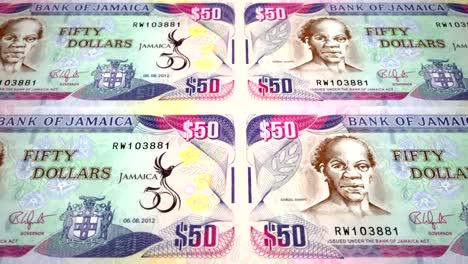 Banknotes-of-fifty-jamaican-dollars-of-Jamaica-rolling,-cash-money,-loop