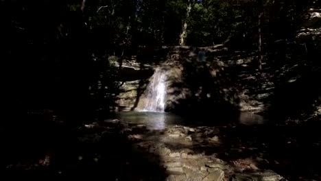 Drone-Aerial-Shot-Approach-to-Waterfall-with-Swimming-Hole-in-Gelendzhik-in-Russia