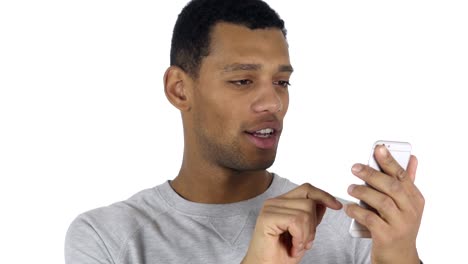 Afro-American-Man-at-Work-Browsing-Smartphone-in-Office