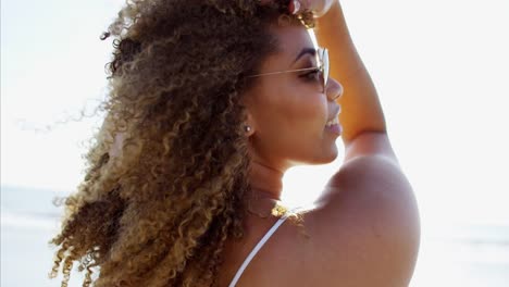 Portrait-of-African-American-female-in-heart-sunglasses