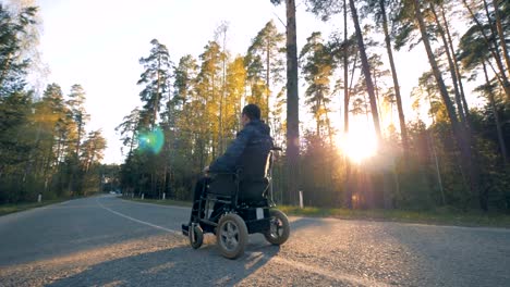 Disabled-person-in-a-powered-wheelchair-starts-moving