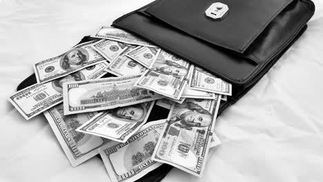 black-money-bag-full-of-dollars,