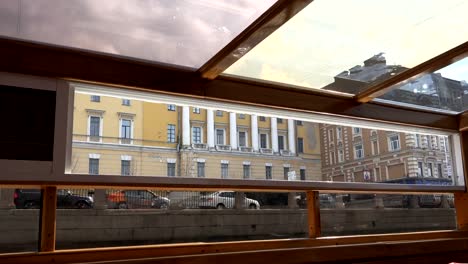 view-from-the-river-to-the-cars-passing-by-the-embankment