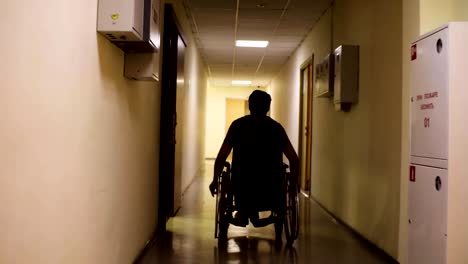 Silhouette-of-disabled-man-in-a-wheelchair-in-the-rehabilitation-center