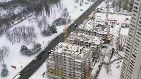 Aerial-view-of-building-construction-site-in-winter