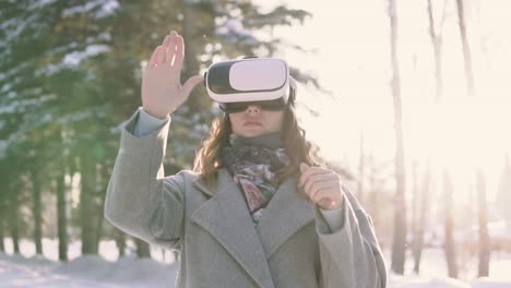 Beautiful-girl-uses-virtual-reality-glasses-having-a-good-mood.