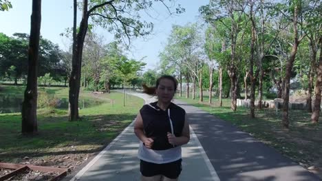 Asian-women-jogging-in-the-street-in-the-early-morning-sunlight-in-garden.-concept-of-losing-weight-with-exercise-for-health.