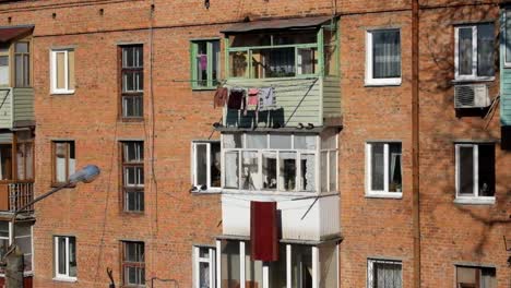 Windows-and-balconies-of-the-old-brick-apartment-building-of-the-USSR.-Khrushev-project-House-1961