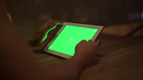 Hands-of-young-Asian-man-using-digital-tablet