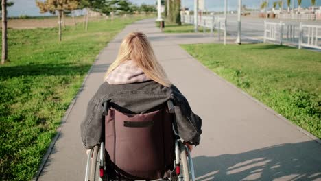 Woman-in-wheelchair-on-outdoor-walk