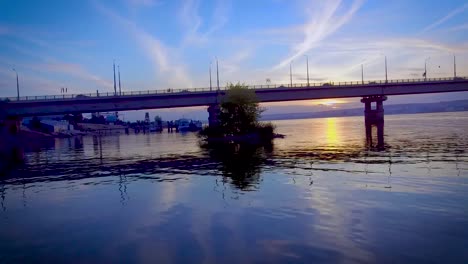 Boat-floats-under-the-bridge