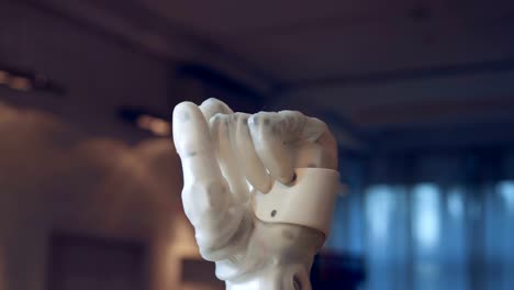 Futuristic-prosthesis-bending-fingers,-close-up.