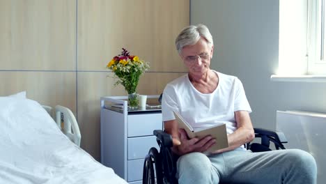 Aged-wheelchaired-man-sitting-in-the-cubicle